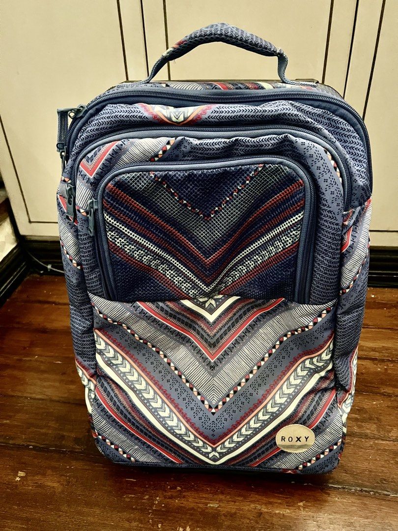 Roxy luggage trolley bag (Category: Luggage) located in Paranaque City. Submitted by elle21fabfinds (Listing ID 1449211264, Image 2). Description: Roxy luggage, perfect as hand carry luggage or outing bag. Only flaw is the cracked rubber on the wheel due to storage, need to replace. But overall, the body/ zippers are in excellent condition. .