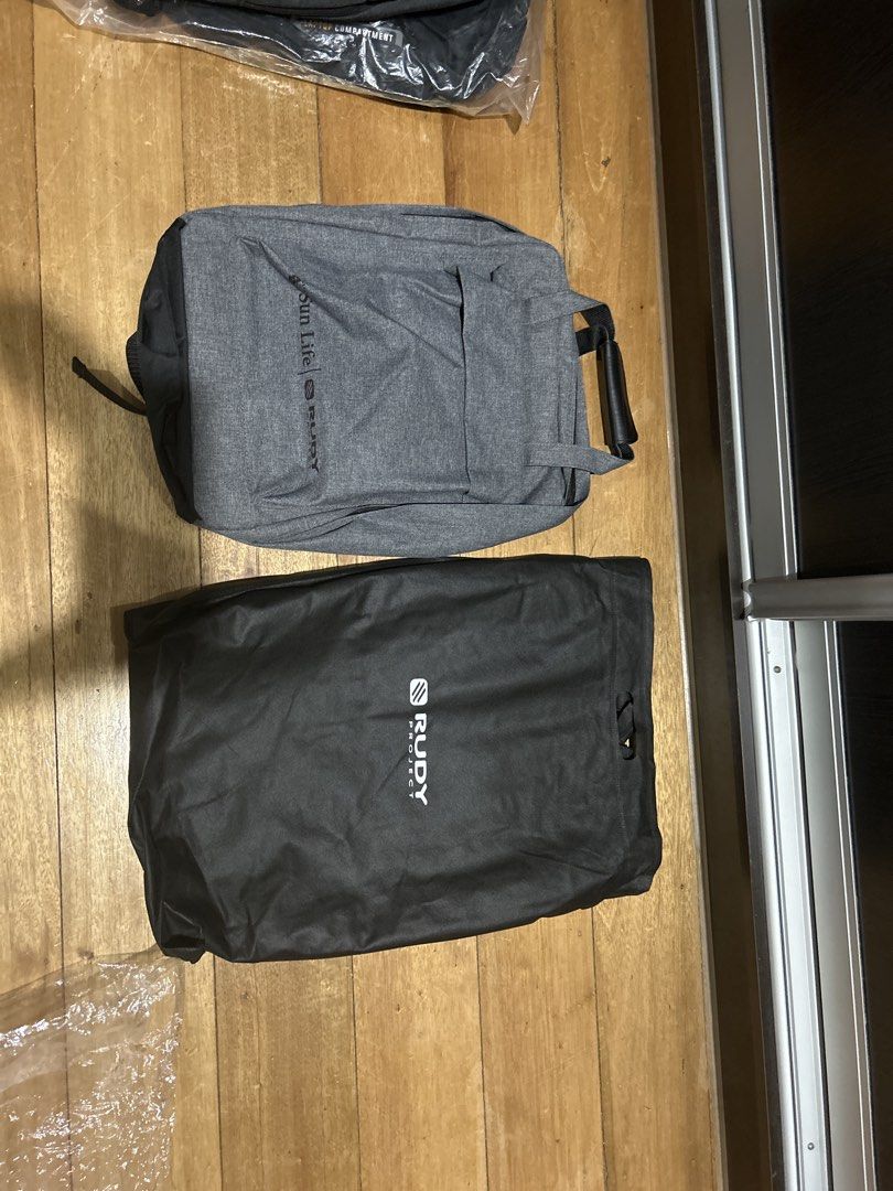 Rudy Project Grey Backpack with Multiple Compartments (Category: Backpacks) located in Manila. Submitted by Declutterland (Listing ID 1449282263, Image 1). Description: - Stylish grey backpack with black accents. - Main compartment with securing straps for your belongings. - Front compartment with mesh pockets and zippered sections for easy organization. - Comfortable padded shoulder straps. - Convenient top handle for alternative carrying. - Ide