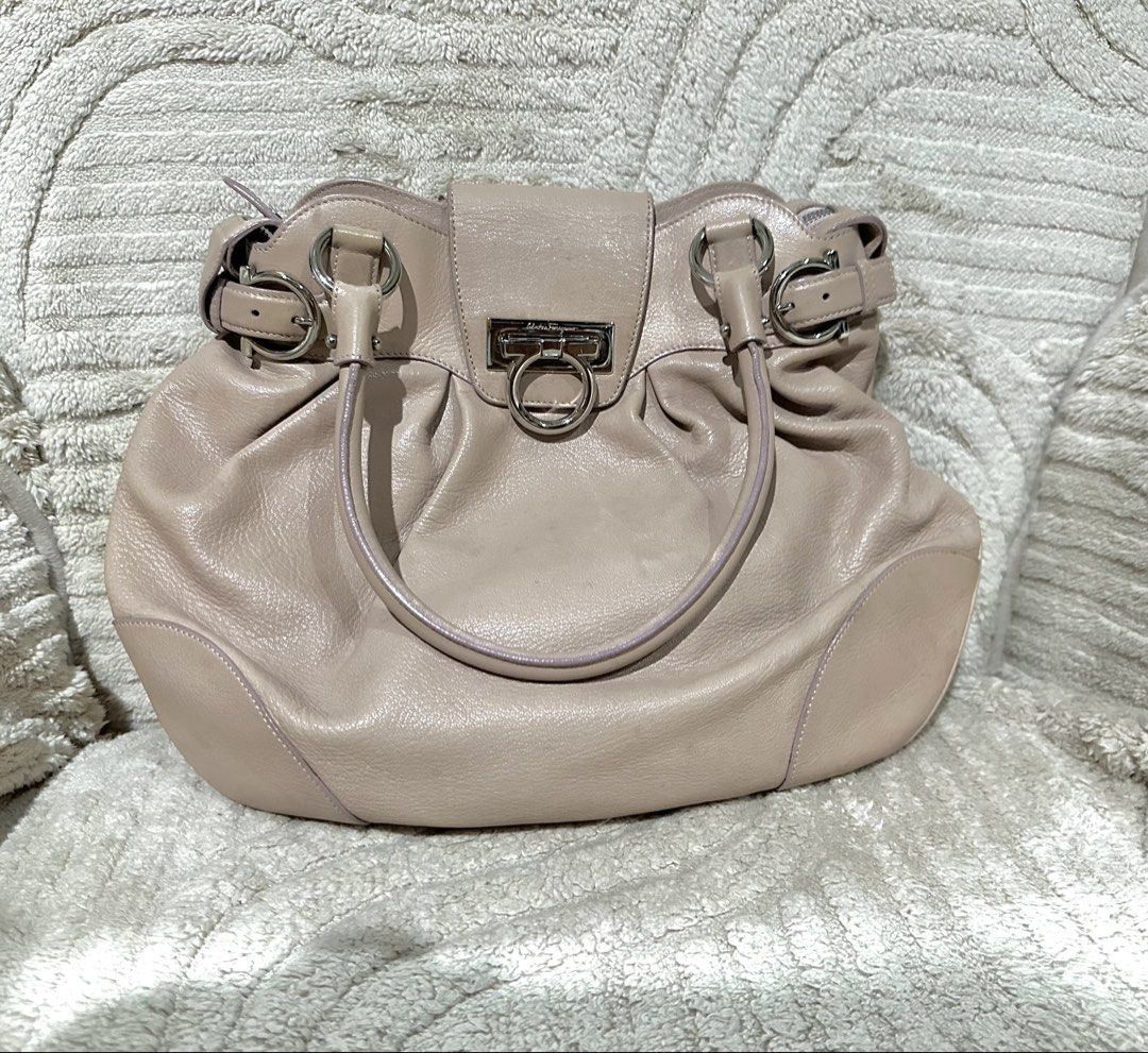 Salvatore Ferragamo Gancini Shoulder Bag (Category: Luxury Bags & Wallets) located in Quezon City. Submitted by marengcondo (Listing ID 1449274568, Image 1). Description: - Authentic Salvatore Ferragamo shoulder bag - Color: Light pink - Material: Genuine Leather - Signature Gancini hardware detail - Features a lovely shape and good internal capacity - light discoloration on outside; visible discoloration on inside flap (see second pic) Will try 