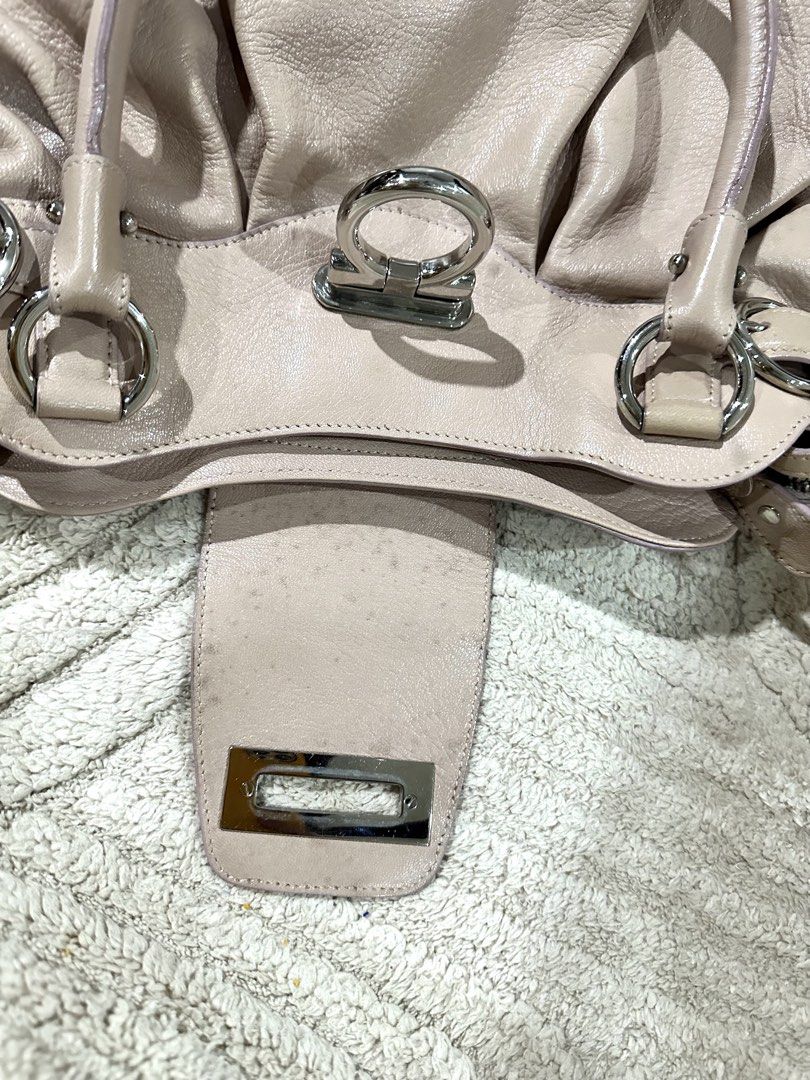 Salvatore Ferragamo Gancini Shoulder Bag (Category: Luxury Bags & Wallets) located in Quezon City. Submitted by marengcondo (Listing ID 1449274568, Image 2). Description: - Authentic Salvatore Ferragamo shoulder bag - Color: Light pink - Material: Genuine Leather - Signature Gancini hardware detail - Features a lovely shape and good internal capacity - light discoloration on outside; visible discoloration on inside flap (see second pic) Will try 