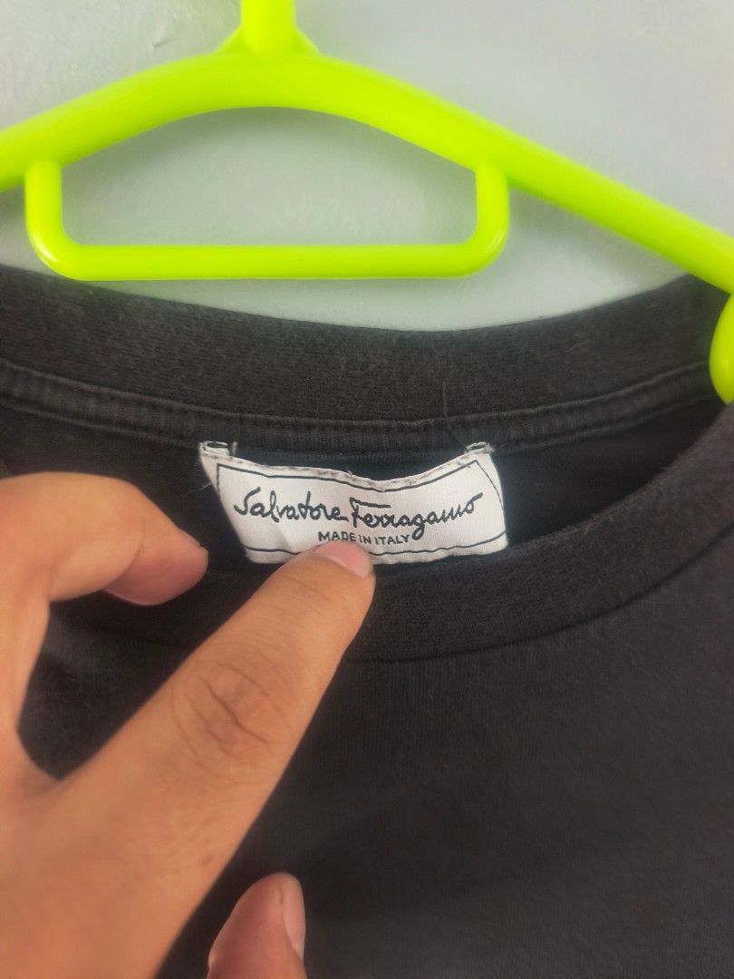 Salvatore Ferragamo t-shirt (Category: Announcements) located in Cagayan de Oro. Submitted by jamesb2854 (Listing ID 1449156311, Image 3). Description: This black Salvatore Ferragamo t-shirt features a distinctive "1927" logo graphic on the chest. Good condition Color rate 7.5/10 Dimes: 16.5×25 inches.