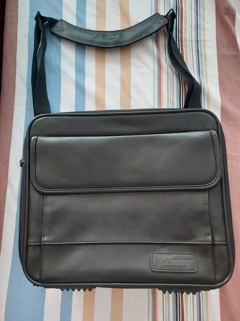Targus Black Leather Laptop Bag Briefcase (Category: Briefcases) located in Las Pinas. Submitted by jerri44 (Listing ID 1449111767, Image 2). Description: - Genuine Targus black leather briefcase for 14inch laptop - Multiple interior compartments for organized storage - Padded section specifically for laptop protection - Comfortable, detachable shoulder strap included - Sturdy top handle for easy carrying - All zippers are in excellent working co