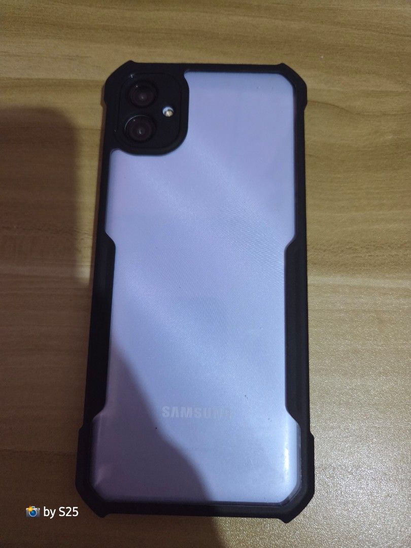 SAMSUNG A04e (Category: Samsung) located in Candelaria. Submitted by sarisaristore16 (Listing ID 1449326671, Image 2). Description: - Samsung A04e - Light purple color - Comes with protective case - Negotiable RFS Power and Volume hindi na masyado gumagana with Xundd case, bagong bili lang walang charger and box pero usb-c naman ang port nya. .