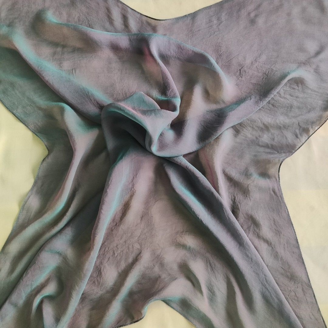 Duochrome (Color Shift Dark Mauve Purple/Subtle Metallic Green) Scarf (Category: Scarves) located in Kuala Lumpur. Submitted by hasamdins_sukathrift_shop (Listing ID 1449229434, Image 3). Description: Size: Approx 32x35inch Material: Thin Crepe Silk Condition: No noticeable defect.