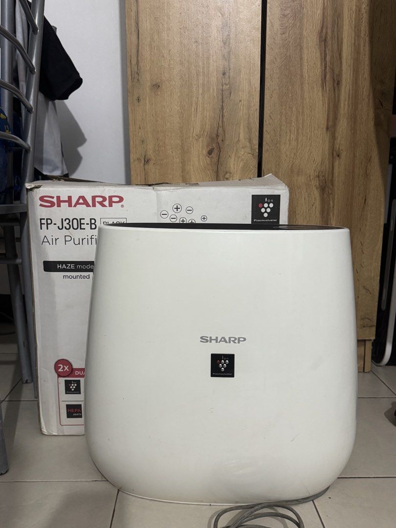 SHARP Air Purifier FP-J30E-B Plasmacluster Ion Technology (Category: Air Purifiers & Dehumidifiers) located in Mandaluyong City. Submitted by karenlabvi (Listing ID 1449167724, Image 1). Description: I don’t have a brush so it’s needs further cleaning. RFS: upgrade - Sharp Air Purifier FP-J30E-B - Color: White - Features Plasmacluster Ion technology for cleaner air - Equipped with HEPA filtration to capture fine particles - Includes a special HAZ