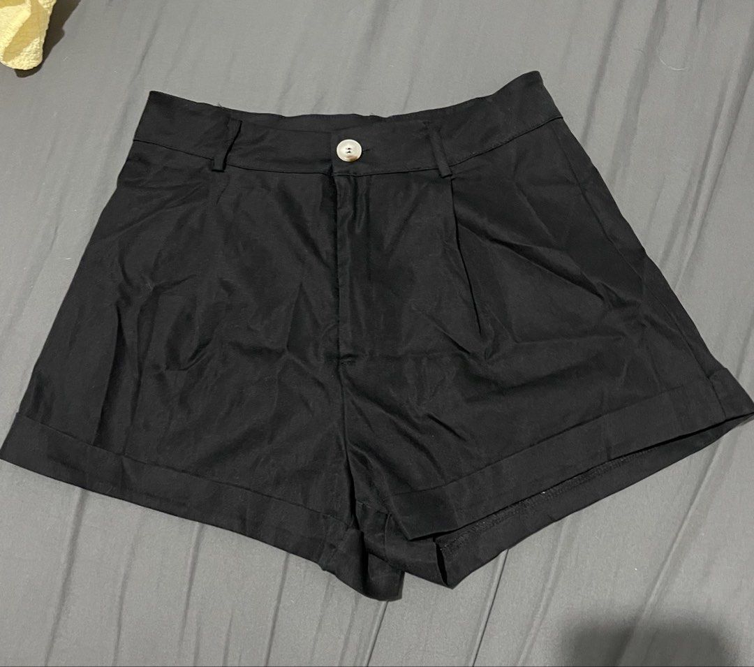 SHEIN Black High Waisted Shorts (Category: Shorts) located in Mandaluyong City. Submitted by blzstr (Listing ID 1449222210, Image 2). Description: - Brand: SHEIN - Color: Black - Size: M - Style: High-waisted shorts - Closure: Button and zip - Features: Belt loops, pleated front, cuffed hem - Condition: worn once - Versatile: Great for casual or dressed-up looks.