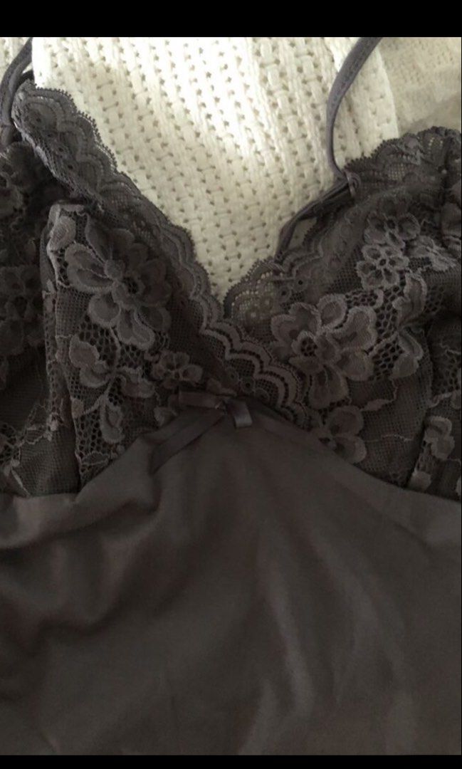 Lace Top Dark Grey Size S (Category: Sleeveless) located in Manila. Submitted by jashdeclutters (Listing ID 1449152251, Image 1). Description: - SHEIN ICON dark grey lace cami top - Features flattering ruched detailing on the front - Adjustable straps for a perfect fit - Versatile: great for layering or wearing on its own - Comfortable and stylish design.