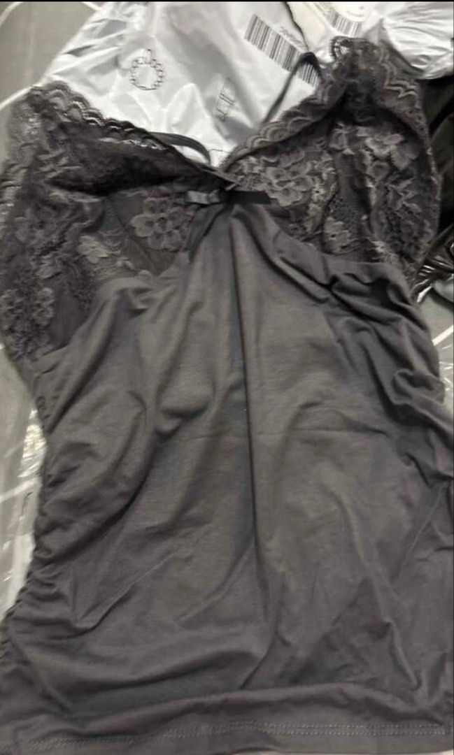 Lace Top Dark Grey Size S (Category: Sleeveless) located in Manila. Submitted by jashdeclutters (Listing ID 1449152251, Image 3). Description: - SHEIN ICON dark grey lace cami top - Features flattering ruched detailing on the front - Adjustable straps for a perfect fit - Versatile: great for layering or wearing on its own - Comfortable and stylish design.