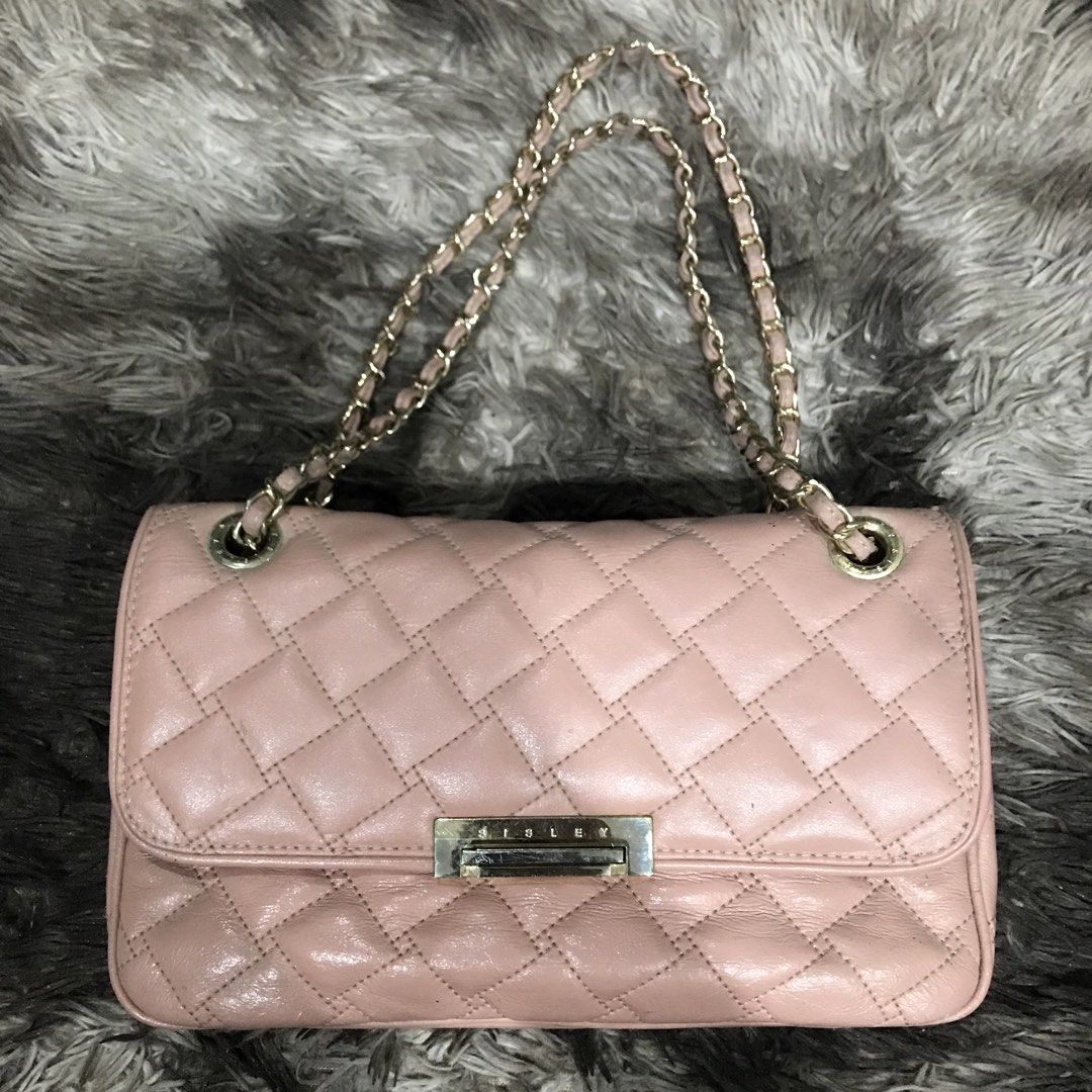 Sisley Pink Quilted Chain Shoulder Bag (Category: Shoulder Bags) located in Manila. Submitted by happyocean_97f34c (Listing ID 1449153680, Image 3). Description: condition 7/10 leather aging and gold hairline - Pink quilted shoulder bag from Sisley - Features a stylish gold chain strap - Secure front clasp closure - Interior includes multiple compartments and a zip pocket - Versatile for everyday use or evening outings - Interior is clean - Minor