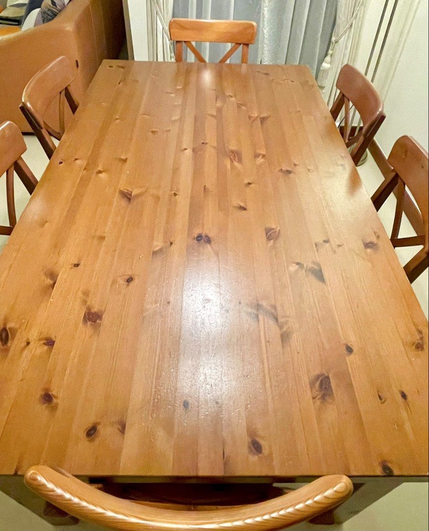 Solid Wood Dining Table (Category: Tables & Sets) located in Singapore. Submitted by robcsg (Listing ID 1449257959, Image 3). Description: - Solid wood dining table ONLY ( no chairs) The table can seat either 4 people, 6 people and Can seat 8 people. - Table dimensions: 1.8m (L) x 1m (W) x 0.75m (H) - Ideal for family meals and entertaining - Ready for a new home - Pickup only.
