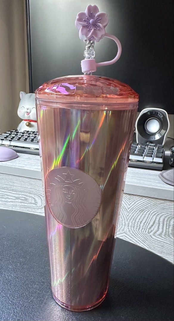 Starbucks Iridescent Tumbler 24oz (Category: Water Bottles & Tumblers) located in Manila. Submitted by nicee_shop (Listing ID 1449238577, Image 1). Description: - Iridescent Starbucks Tumbler - Stunning Pink & Rainbow Colors - Includes Cute Cherry Blossom Straw Topper - Capacity: 24oz / 709ml - Perfect for Cold Beverages - Care Instructions: Hand Wash Only, Do Not Microwave.