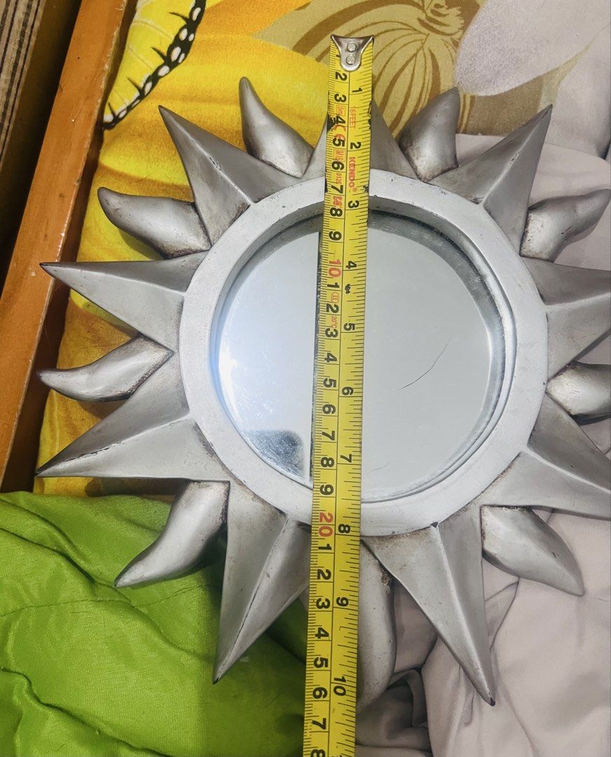 Sunburst Mirror Wall Decor (Category: Mirrors) located in Pasig City. Submitted by mavrugbys_123 (Listing ID 1449128798, Image 2). Description: - Cute sunburst mirror - Silver finish - Adds flair to any room - Measures approx. 8 inches across - Ideal for boho or eclectic decor - Perfect for living room, bedroom, or hallway.