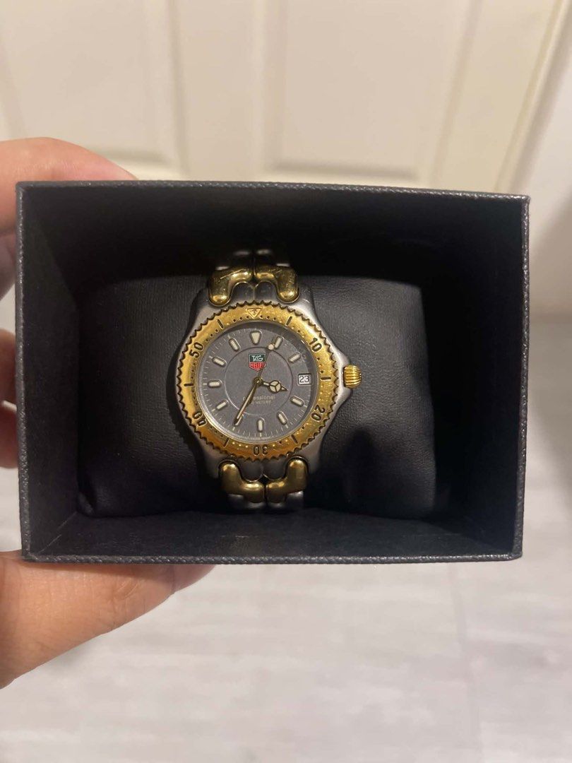 TAG Heuer Two-Tone Watch (Category: Luxury Watches) located in Manila. Submitted by paraisonad60750 (Listing ID 1449223339, Image 1). Description: - Authentic TAG Heuer Watch - Two-tone stainless steel and gold-plated design - Elegant grey dial with date function - Functional rotating bezel - Comes with original box - Versatile for everyday wear or special events.