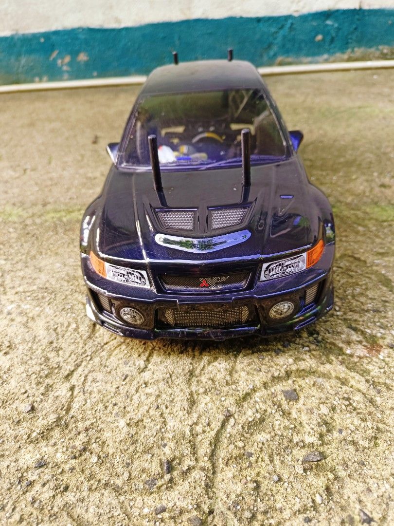 Tamiya tt02 rc lancer evo v 1:10 scale (Category: Remote Control Toys) located in Alfonso. Submitted by mrasterisk (Listing ID 1449166662, Image 2). Description: Electronics parts upgrade: Surpass 60a brushed esc Surpass 25kg digital metal gear servo Radio controller and radio receiver Wheel and shaft bearing set Charger tamiya connector Tamiya torque tuned motor Requires: Rc lipo battery w/Tamiya connector Issue mayroon gasgas at scratches sa ma