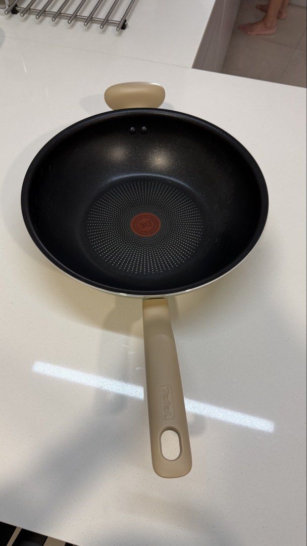 Tefal So Matcha 30cm Wok Pan with Lid (Category: Cookware & Accessories) located in Kuala Lumpur. Submitted by nojoybidderpls (Listing ID 1449108140, Image 3). Description: - Tefal wok pan - Non-stick interior for easy cooking and cleaning - Includes a durable glass lid - Stylish beige exterior and handles - Ideal for stir-frying and various other cooking methods.