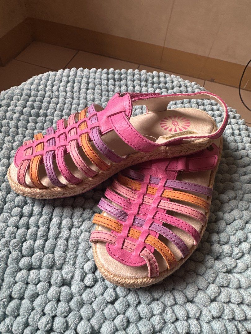 UGG Pink Purple Orange Strappy Sandals (Category: Babies & Kids Fashion) located in Quezon City. Submitted by ur_shop (Listing ID 1449136487, Image 2). Description: - Adorable UGG sandals for kids - Features woven straps in pink, purple, and orange - Easy hook-and-loop closure for quick on and off - Stylish espadrille-style sole - Ideal for summer adventures and everyday wear.