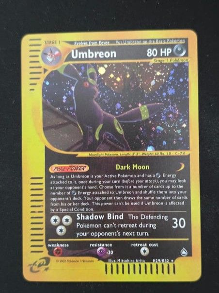 Umbreon Stage 1 Pokemon Card - Dark Moon - H29/M32 (Category: Toys & Games) located in Kuala Lumpur. Submitted by newdolphin-b68933 (Listing ID 1449286797, Image 1). Description: - Umbreon Stage 1 Pokemon Card - Card Number: H29/M32 - HP: 80 - Poke-Power: Dark Moon - Attack: Shadow Bind - Ideal for Pokemon card collectors!.