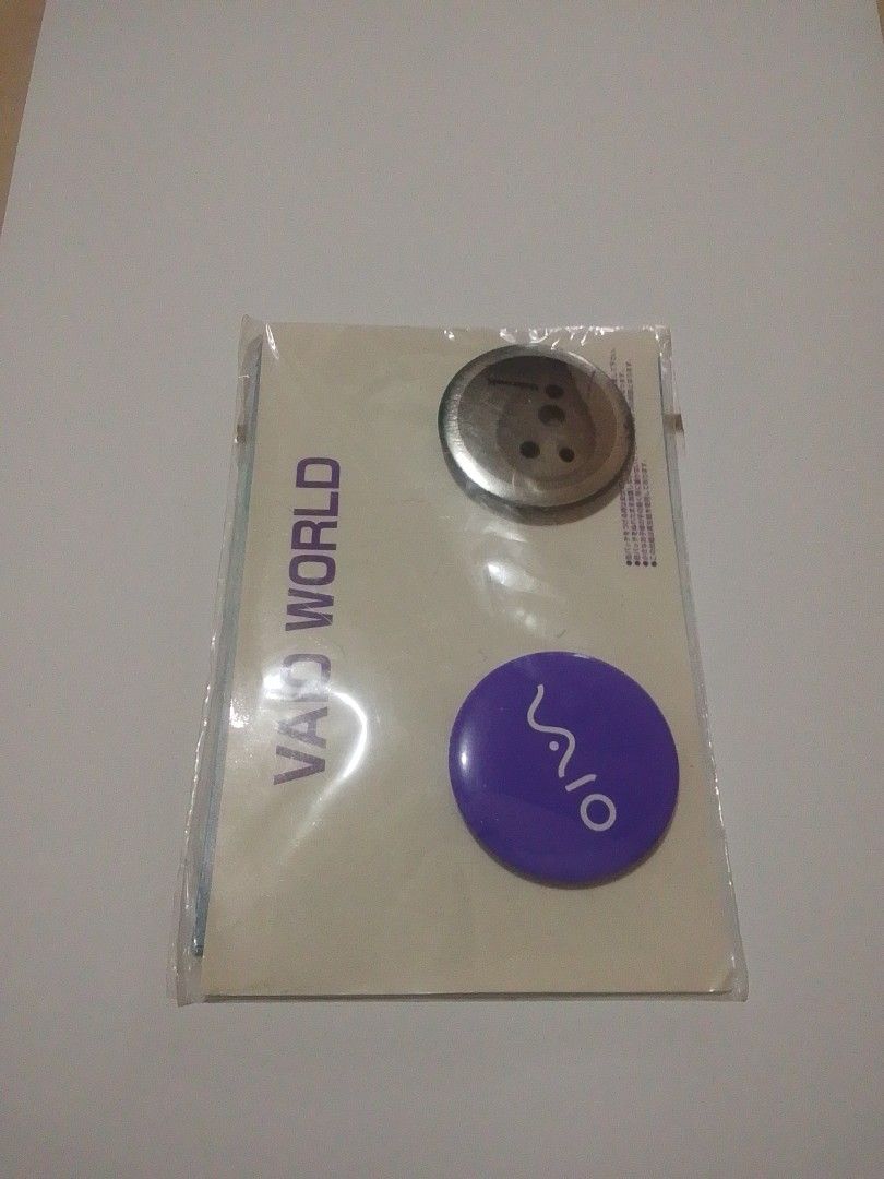 VAIO WORLD merchandise - Button set (Category: Laptops & Notebooks) located in Santa Rosa. Submitted by loisy32336 (Listing ID 1449117383, Image 1). Description: - Authentic VAIO WORLD merchandise - Includes a purple VAIO button - Features a silver circular item - Comes with a VAIO WORLD paper insert - All items are sealed in original plastic packaging - Ideal for VAIO enthusiasts and collectors.