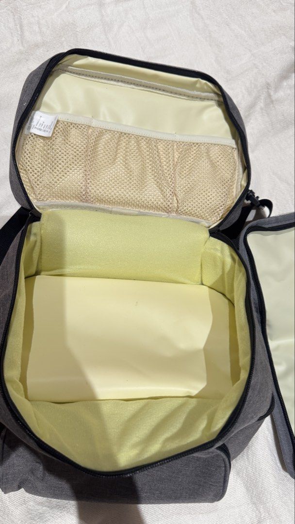 V-Coool Insulated Cooler Bag with Compartments (Category: Breastfeeding & Bottle Feeding) located in Manila. Submitted by sabgonzaga (Listing ID 1449144162, Image 2). Description: - Grey V-Coool cooler bag - Two main zippered compartments - Top compartment with internal mesh pockets - Spacious bottom compartment for food/drinks - Detachable shoulder strap included - Separate zippered pouch for accessories - Ideal for outings and travel Used once 