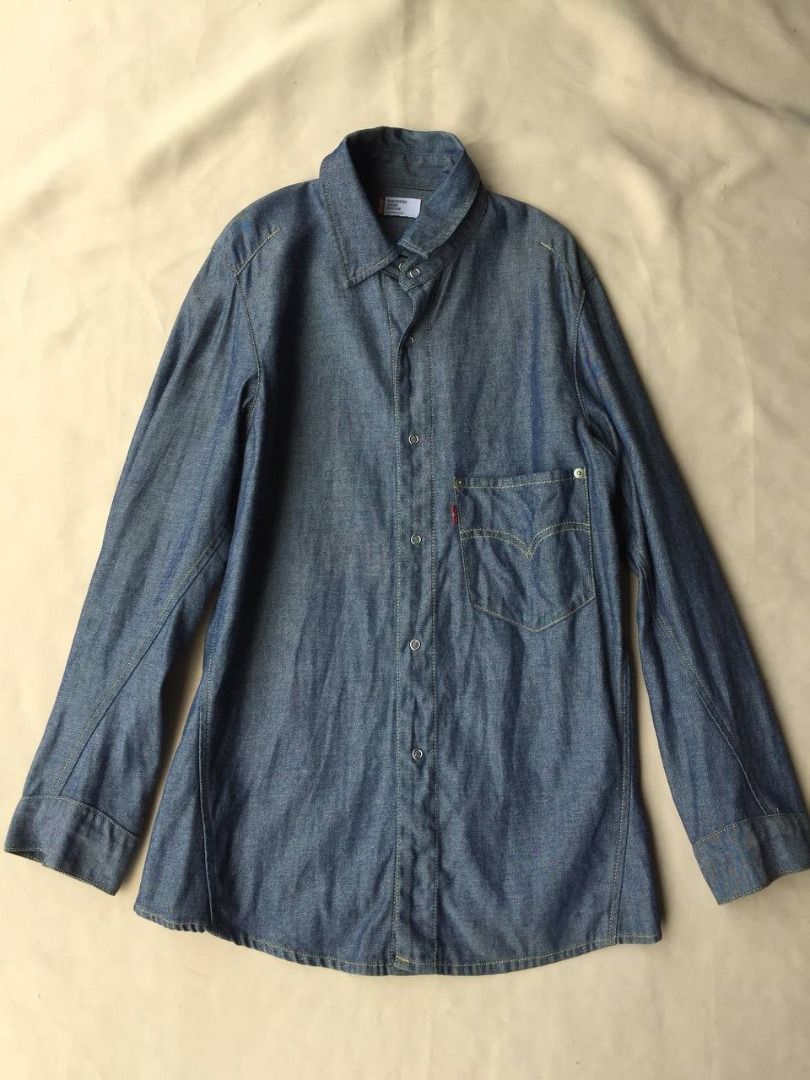 Vintage 2000s LEVIS Enginered Jeans Shirt Jacket (Category: Coats, Jackets and Outerwear) located in Pagsanjan. Submitted by ovothrift (Listing ID 1449198028, Image 3). Description: length - 30 width pit to pit - 19 Manufactured June 2000 very good condition authentic made in japan on tag issue - missing patch, has very minimal fade (see 3 last pics), Features asymmetrical chest pocket, asymmetrical or twisted stitching on sleeves and body design