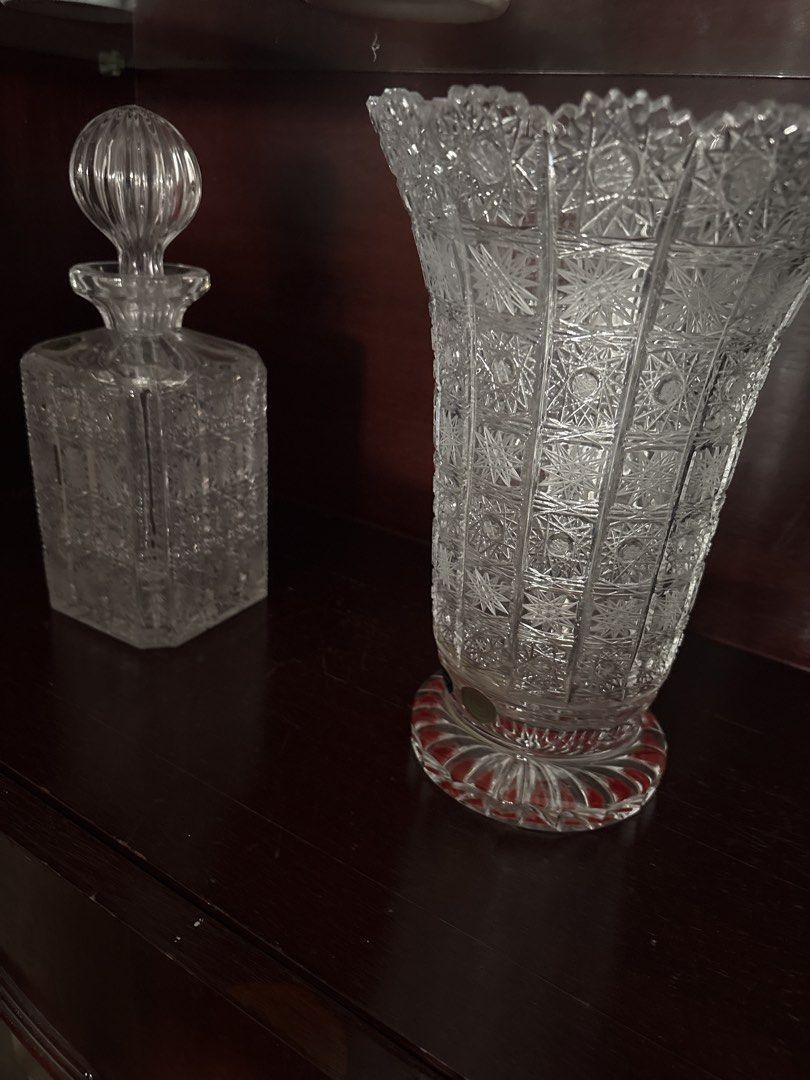 Vintage Crystal Decanter and Cut Glass Vase (Category: Vases & Decorative Bowls) located in Kuala Lumpur. Submitted by 2econd2pace (Listing ID 1449167437, Image 1). Description: - Beautiful crystal decanter with stopper - Intricately cut glass vase with red-tinted base - Both pieces feature detailed patterns - Perfect for display or serving - Adds a classic, elegant touch to home decor - Great for collectors or as a statement piece.