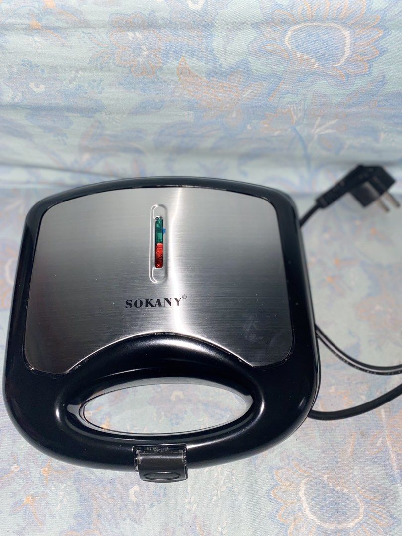 Waffle Maker (Category: Breadmakers) located in Manila. Submitted by trixxxyyy06 (Listing ID 1449184652, Image 1). Description: Waffle Maker * Brand : Sokany * Brand New * Easy to cook * Negotiable if sure buyer.