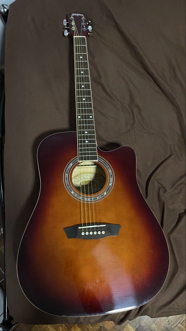Washburn Acoustic Guitar (Category: Musical Instruments) located in Santa Rosa. Submitted by panda306 (Listing ID 1449303907, Image 1). Description: Washburn Acoustic Guitar – Excellent Condition 🎸 Price: ₱6000 Selling my Washburn Acoustic Guitar in excellent condition. Well-maintained and sounds great with a warm, balanced tone—perfect for beginners, students, hobbyists, or even experienced players looking for a reliable acoustic guitar. Featur