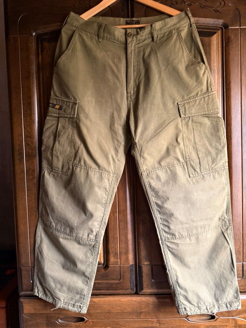 WTAPS Cargo Fatigue Pants Olive Green (Category: Trousers) located in Cabatuan. Submitted by kulas799 (Listing ID 1449198314, Image 2). Description: - WTAPS Military Cargo Fatigue Pants - Color: Olive Green - Size: Tagged M - Material: Durable Cotton - Features: Multiple pockets, ankle drawstrings - Style: Ideal for casual wear waist 16.5 (32-33) overall length 40 leg opening 8.5.