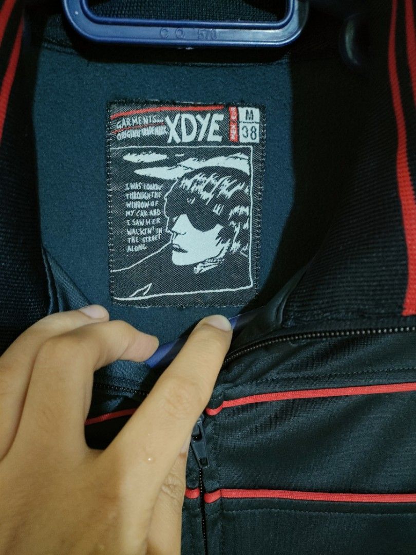 XDYE Track Jacket Size M (Category: Coats, Jackets and Outerwear) located in General Santos City (Dadiangas). Submitted by rjb21 (Listing ID 1449224141, Image 2). Description: - Navy blue track jacket - Red stripe details on collar, cuffs, and chest - Full zip front - Two side pockets - Size: Medium (M) 38 - Ideal for casual wear or sports activities.