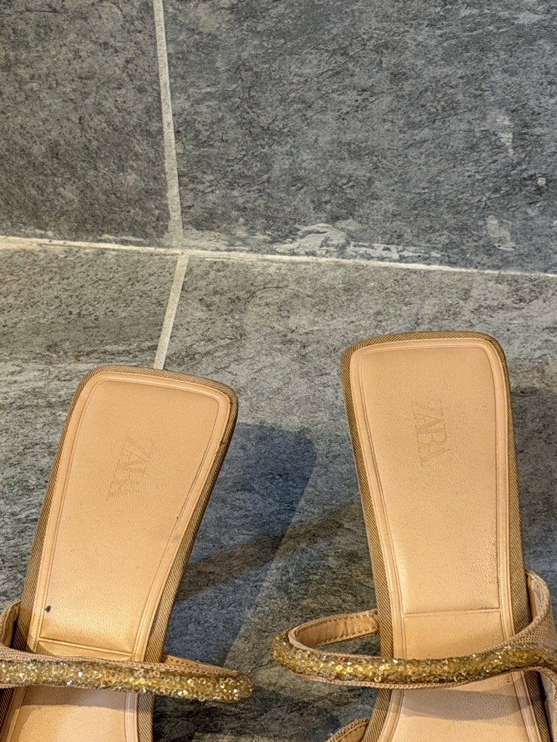 Zara Embellished Mules Heels (Category: Heels) located in Taguig. Submitted by acappaca2 (Listing ID 1449152233, Image 2). Description: - Zara Mules Heels - Pointed toe design - Two thin straps across the foot - Embellished with small beads - Light beige/nude color - Easy slip-on style - Versatile for dressing up or down.
