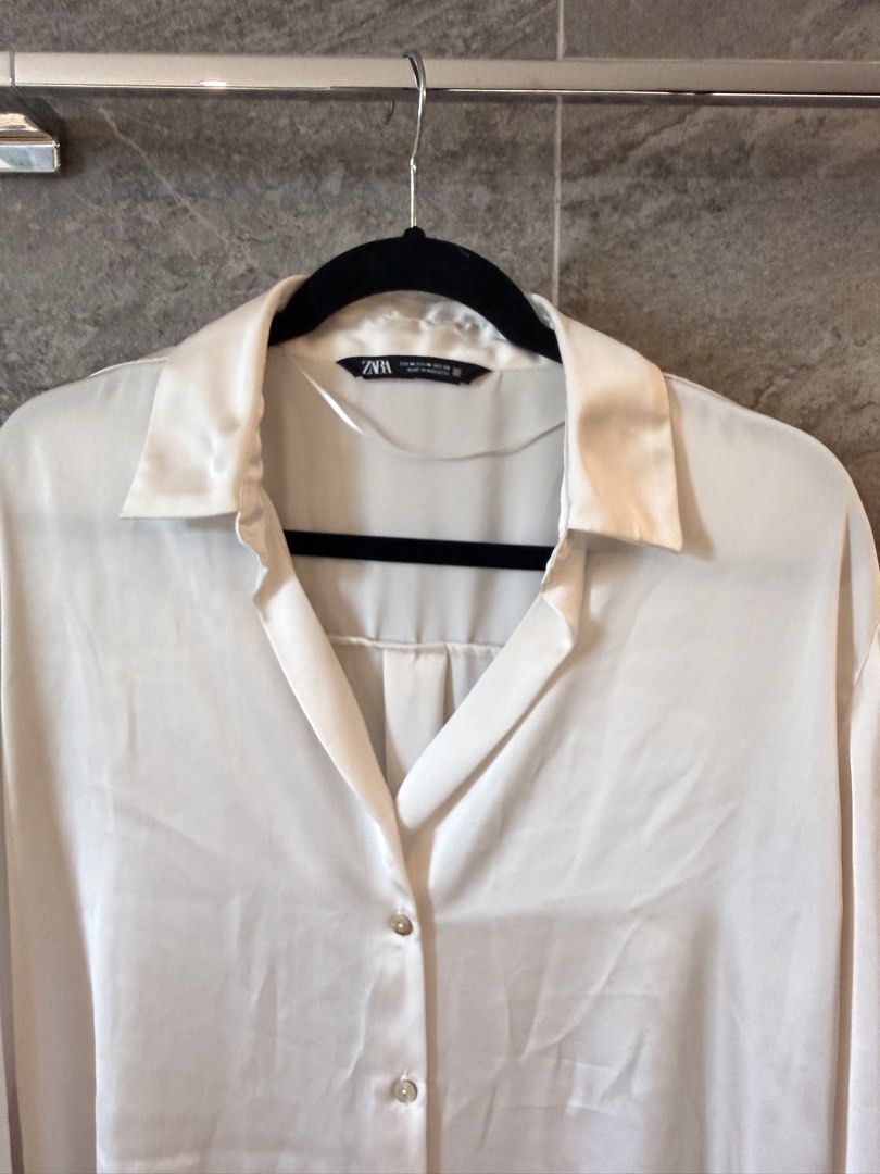 Zara Satin Button-Up Shirt (Category: Shirts) located in Taguig. Submitted by acappaca2 (Listing ID 1449152634, Image 3). Description: - Zara cream satin shirt - Long sleeves with button cuffs - Classic collar and button front - Versatile for dressing up or down.