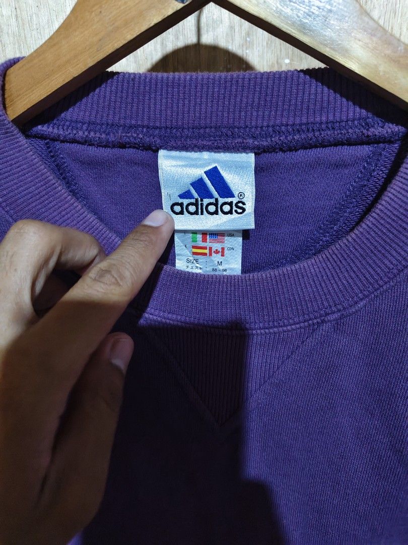 Adidas Purple Sweatshirt Crewneck (Category: Coats, Jackets and Outerwear) located in Butuan. Submitted by zhakmarcus (Listing ID 1449436263, Image 2). Description: - Vintage Adidas crewneck sweatshirt - Nice purple color - Small yellow Adidas logo on the chest - Tag size: M - Classic fit - Great for casual wear.