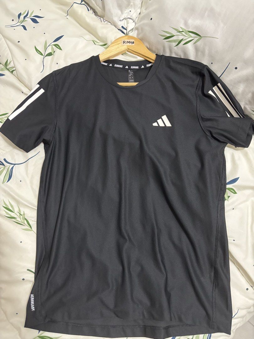 Adidas Running Aeroready T-shirt (Category: Activewear) located in Kuala Lumpur. Submitted by rien_opahcrochet (Listing ID 1449510021, Image 1). Description: - Grey Adidas running t-shirt - Classic three stripes on sleeves - Adidas logo on chest - Made with Aeroready material for dryness - Suitable for workouts and casual wear.