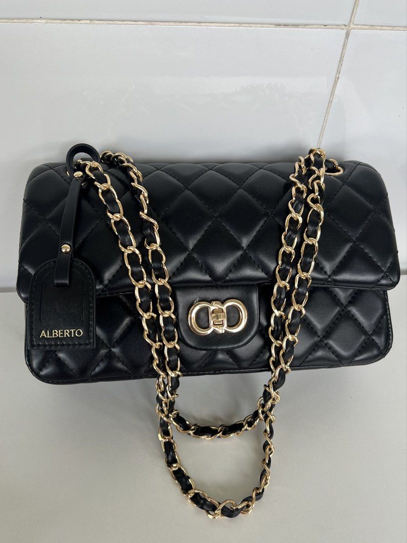 ALBERTO The Margate Quilted Chain Shoulder Bag (Category: Shoulder Bags) located in Naga. Submitted by ajmaq (Listing ID 1449415432, Image 2). Description: - ALBERTO Margate bag - Elegant quilted design - Gold-tone hardware - Structured silhouette - Versatile chain strap - Luxurious red interior lining - Secure magnetic snap closure - Comes with a matching tag - Ideal for dressing up or down -Medium -used once.