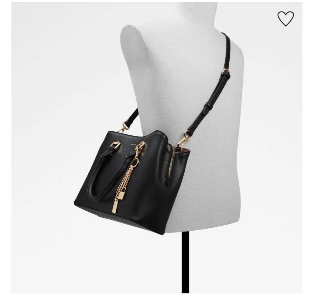 ALDO Black Leather Top Handle Bag with Charm (Category: Luxury Bags & Wallets) located in Marikina City. Submitted by mycollectionsph (Listing ID 1449482628, Image 2). Description: Black leather Aldo handbag. Gold hardware details. Comes with a cute charm featuring a lock and key. Top handles and a detachable shoulder strap. Zipper closure. Interior has a contrasting deep red lining. Dust bag included..