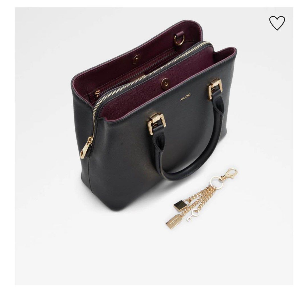 ALDO Black Leather Top Handle Bag with Charm (Category: Luxury Bags & Wallets) located in Marikina City. Submitted by mycollectionsph (Listing ID 1449482628, Image 1). Description: Black leather Aldo handbag. Gold hardware details. Comes with a cute charm featuring a lock and key. Top handles and a detachable shoulder strap. Zipper closure. Interior has a contrasting deep red lining. Dust bag included..