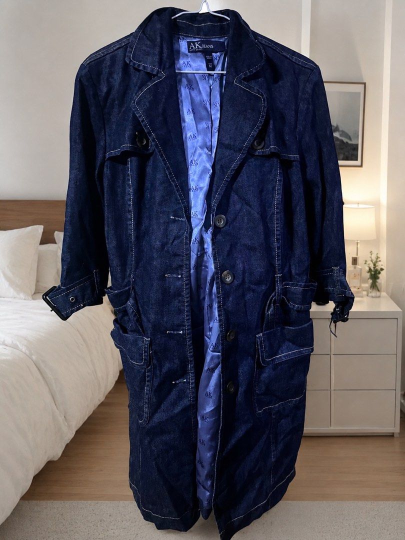 Anne Klein Denim Trench Coat (Category: Coats, Jackets and Outerwear) located in Manila. Submitted by mstenj (Listing ID 1449498715, Image 1). Description: - AK Jeans by Anne Klein dark wash denim trench coat - Bright blue satin lining with AK Jeans logo print - Button front closure - Belt detail at the waist - Two front pockets - Versatile layering piece for any season.