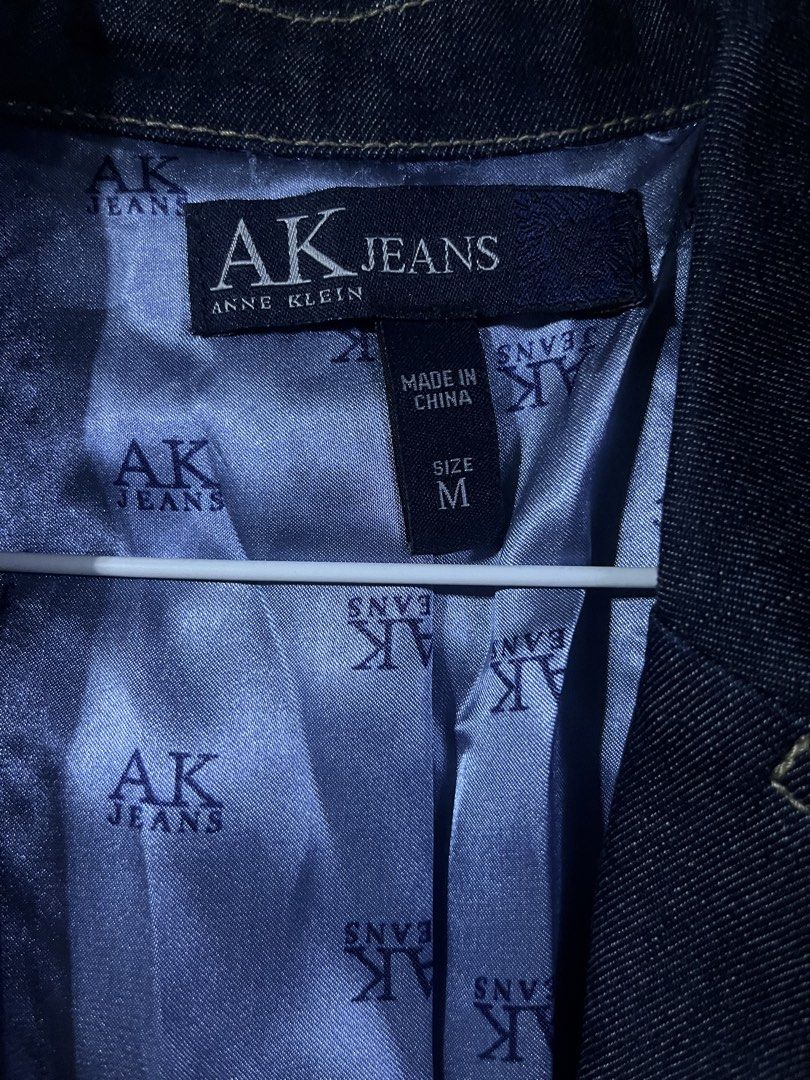 Anne Klein Denim Trench Coat (Category: Coats, Jackets and Outerwear) located in Manila. Submitted by mstenj (Listing ID 1449498715, Image 3). Description: - AK Jeans by Anne Klein dark wash denim trench coat - Bright blue satin lining with AK Jeans logo print - Button front closure - Belt detail at the waist - Two front pockets - Versatile layering piece for any season.
