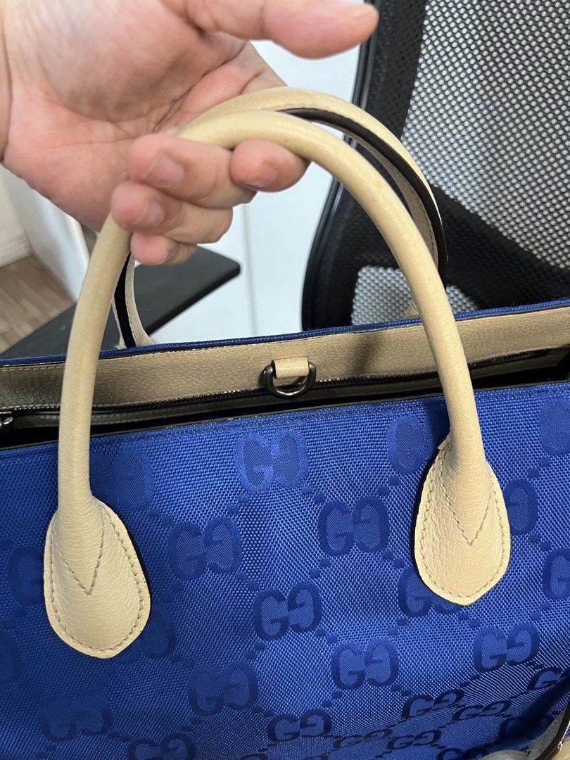 Authentic Gucci GG Off-the-grid Monogram Blue Nylon Tote (Category: Luxury Bags & Wallets) located in Muntinlupa City. Submitted by goldinmygarage (Listing ID 1449500168, Image 3). Description: - Authentic Blue Gucci Tote Bag - Signature GG Pattern - Beige Leather Trim and Handles - Spacious interior for essentials - Ideal for everyday use or travel.