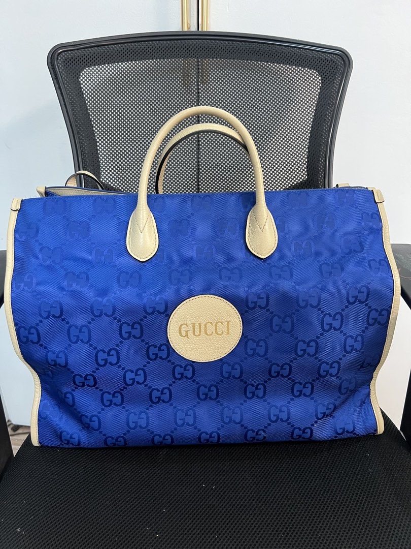 Authentic Gucci GG Off-the-grid Monogram Blue Nylon Tote (Category: Luxury Bags & Wallets) located in Muntinlupa City. Submitted by goldinmygarage (Listing ID 1449500168, Image 1). Description: - Authentic Blue Gucci Tote Bag - Signature GG Pattern - Beige Leather Trim and Handles - Spacious interior for essentials - Ideal for everyday use or travel.