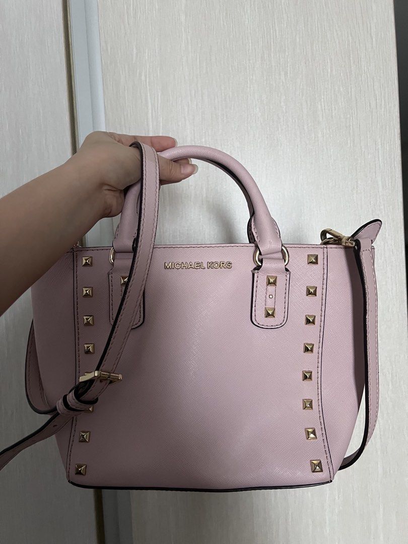 Authentic Michael Kors Two Way Bag (Category: Luxury Bags & Wallets) located in Manila. Submitted by ot7purple (Listing ID 1449355313, Image 1). Description: - Authentic Michael Kors bag in a lovely light pink color - Two way comes with both top handles and a detachable crossbody strap -Used only a few times ***Shipping fee not included. 📲IG: sofiajeneve.