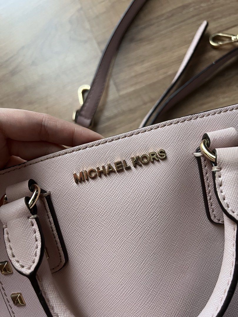 Authentic Michael Kors Two Way Bag (Category: Luxury Bags & Wallets) located in Manila. Submitted by ot7purple (Listing ID 1449355313, Image 3). Description: - Authentic Michael Kors bag in a lovely light pink color - Two way comes with both top handles and a detachable crossbody strap -Used only a few times ***Shipping fee not included. 📲IG: sofiajeneve.
