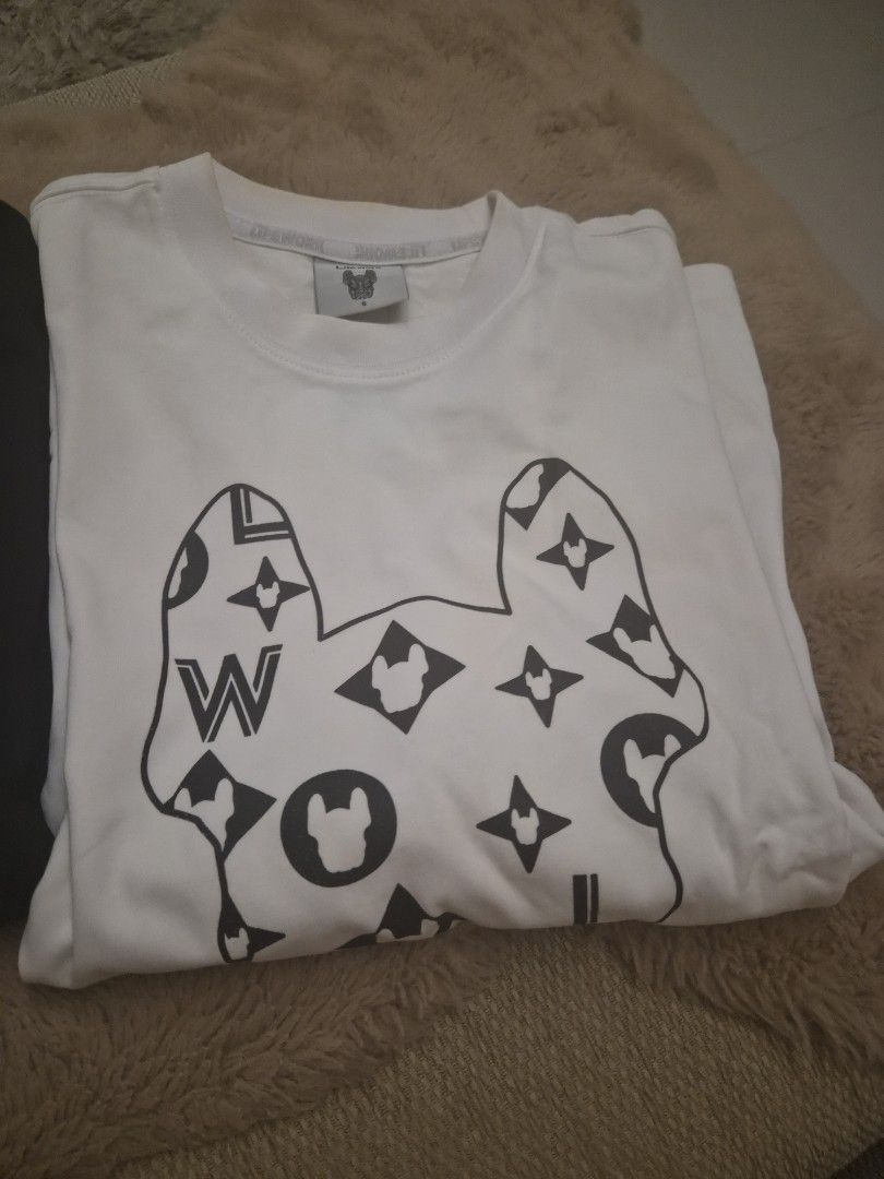 Lifework (Category: Tshirts & Polo Shirts) located in Singapore. Submitted by candy.yong.9 (Listing ID 1449496808, Image 1). Description: - Bundle deal: 2 graphic tees - White tee with KAWS-inspired print - Black tee with BAPE camo ape head design - Both are short-sleeved - Ideal for streetwear enthusiasts.