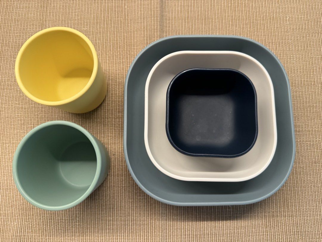Beaba Silicone Nesting Bowls and 2 silicone cups (Category: Weaning & Toddler Feeding) located in Valenzuela. Submitted by jaylight (Listing ID 1449509326, Image 3). Description: - Beaba set includes 3 stackable square bowls (1 large grey, 1 white, 1 navy blue). - Set includes 2 stackable cups (1 teal, 1 yellow). - Ideal for serving snacks or as kitchen prep bowls. - Designed for easy and space-saving storage..