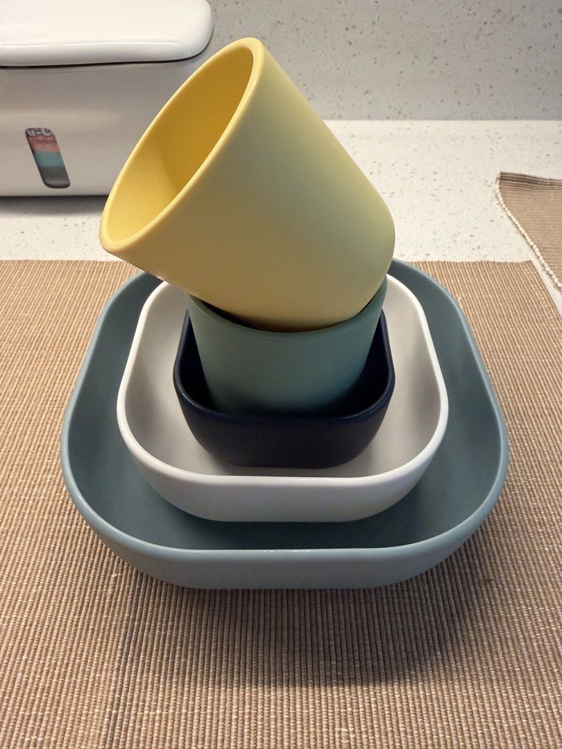 Beaba Silicone Nesting Bowls and 2 silicone cups (Category: Weaning & Toddler Feeding) located in Valenzuela. Submitted by jaylight (Listing ID 1449509326, Image 2). Description: - Beaba set includes 3 stackable square bowls (1 large grey, 1 white, 1 navy blue). - Set includes 2 stackable cups (1 teal, 1 yellow). - Ideal for serving snacks or as kitchen prep bowls. - Designed for easy and space-saving storage..