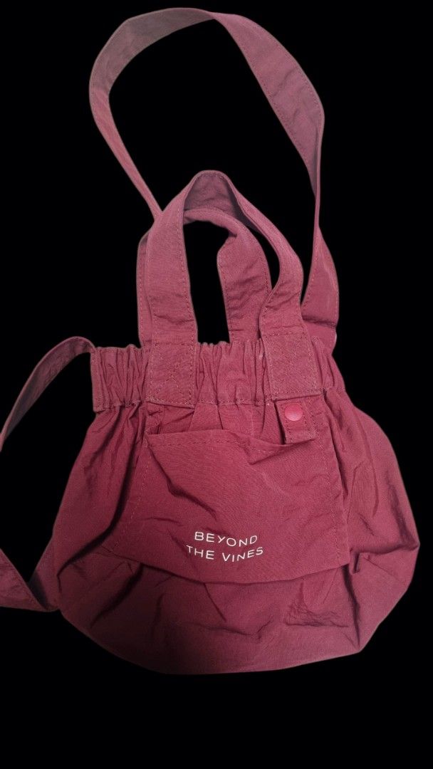 Beyond The Vines Nylon Drawstring micro (Category: Cross-body Bags) located in Quezon City. Submitted by kcobs (Listing ID 1449465959, Image 1). Description: - Brand: Beyond The Vines - guaranteed authentic 💯 - Type: Drawstring Bag - Color: Burgundy/Maroon - Material: 100% Nylon - Features: Front pocket with snap button closure, adjustable straps - Benefits: Great for everyday use, easy to pack and carry -size: micro - used several times, like 5