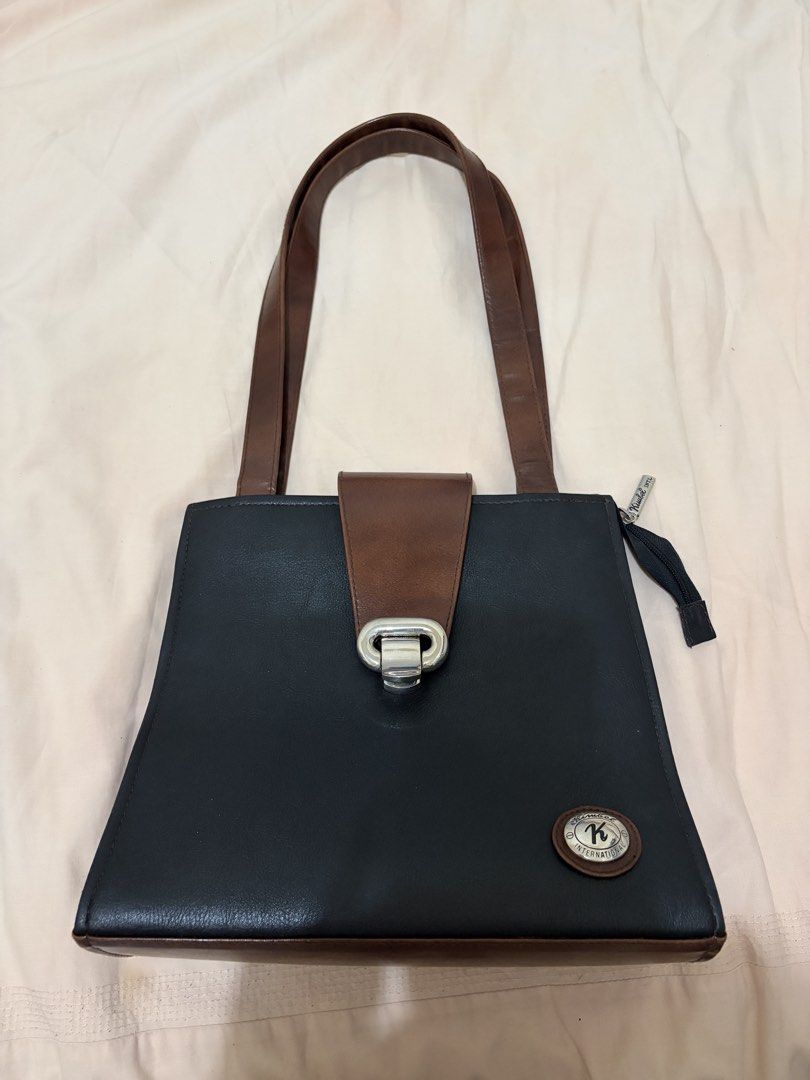 Black Brown Leather Top Handle Bag (Category: Shoulder Bags) located in Antipolo. Submitted by nnnxjje (Listing ID 1449466065, Image 1). Description: - Kimbel bag - no issues - used a few times only - can fit a lot - price is negotiable for sure buyers.