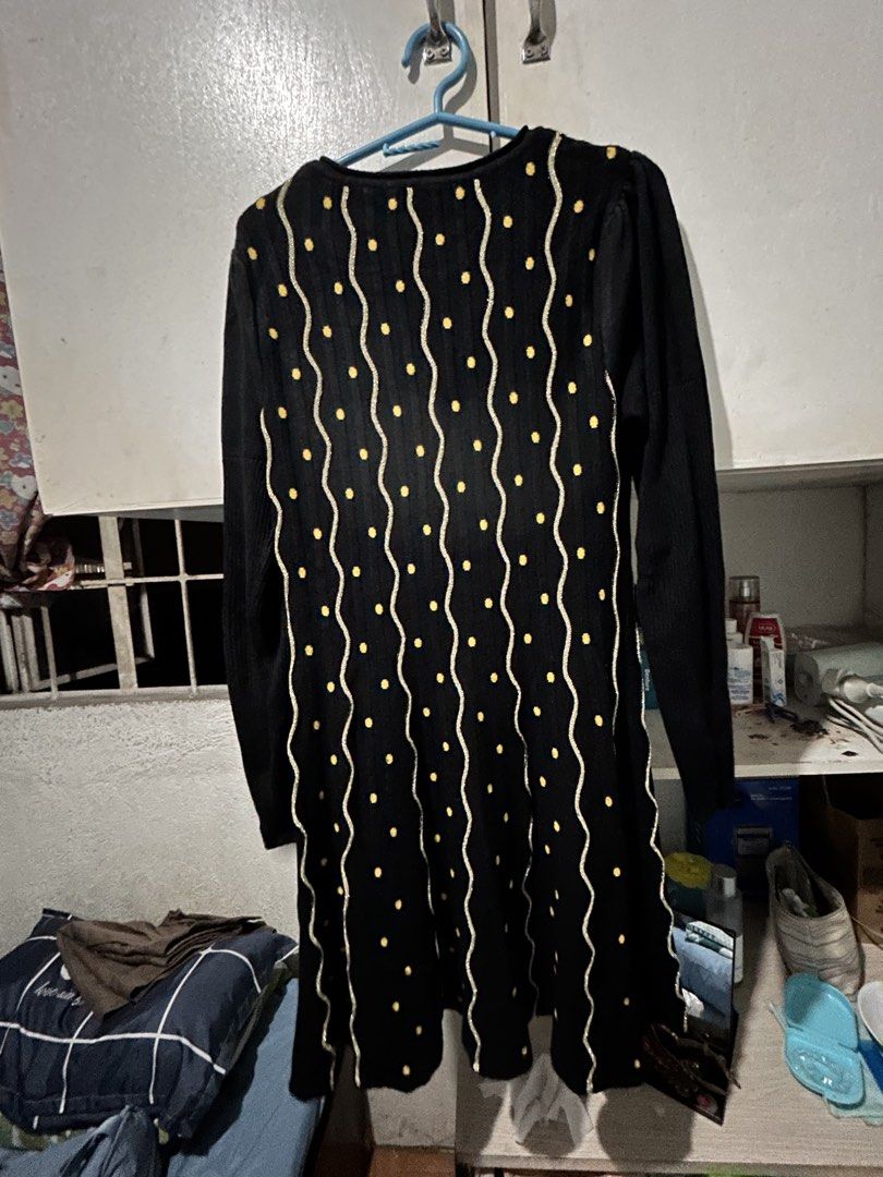 Black Long Sleeve Dress with Yellow Polka Dot Pattern (Category: Dresses) located in Baliuag. Submitted by declutteringbyjmt (Listing ID 1449457772, Image 3). Description: - Black long sleeve dress - Features a fun yellow polka dot and wavy line pattern - Textured knit fabric for comfort - Versatile for casual or dressed-up looks - Comfortable and stylish design.