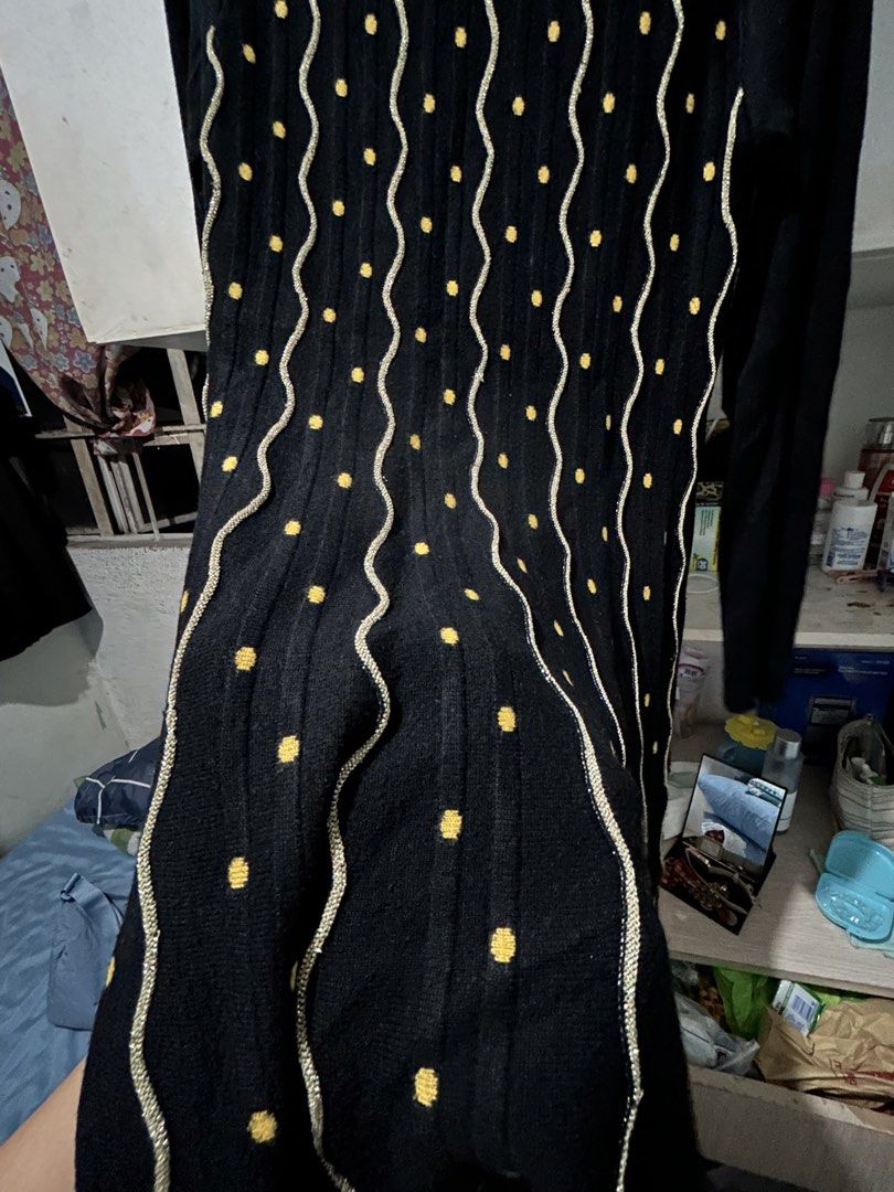 Black Long Sleeve Dress with Yellow Polka Dot Pattern (Category: Dresses) located in Baliuag. Submitted by declutteringbyjmt (Listing ID 1449457772, Image 2). Description: - Black long sleeve dress - Features a fun yellow polka dot and wavy line pattern - Textured knit fabric for comfort - Versatile for casual or dressed-up looks - Comfortable and stylish design.