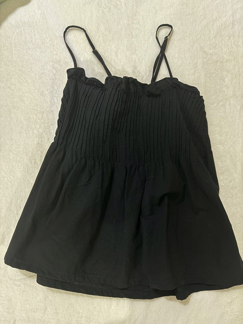 Black Smocked Camisole Top with Spaghetti Straps (Category: Sleeveless) located in Quezon City. Submitted by m3gan8 (Listing ID 1449386498, Image 2). Description: - Cute black camisole top - Smocked bodice with pleats - Adjustable spaghetti straps - Slightly flared hem - Versatile for casual or dressed-up outfits - Easy to pair with jeans or skirts.